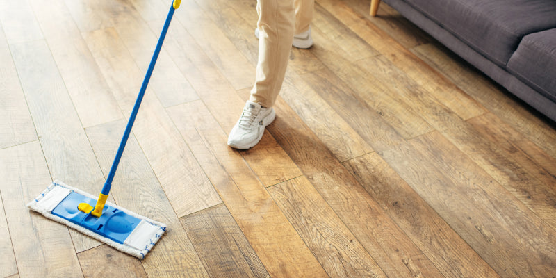 Engineered hardwood flooring being cleaned
