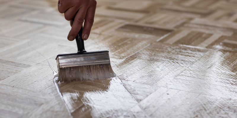 Hardwood floor being recoated