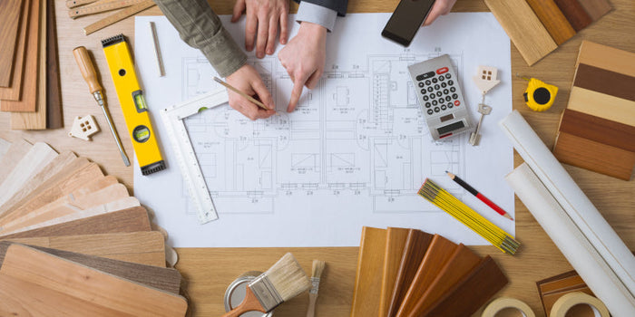 Two individuals working on a house remodel