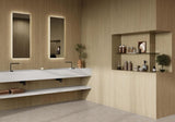 Modern bathroom with wood look porcelain wall tile, a sink, and shelves with decorative items.