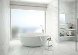 Updated bath with Spanish porcelain tile floor and freestanding tub.