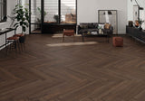 Modern living room with chevron wood-look porcelain tile flooring, furniture, and decor.