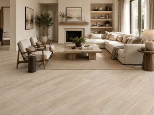 Light ash wood look porcelain plank flooring shown installed in a room setting