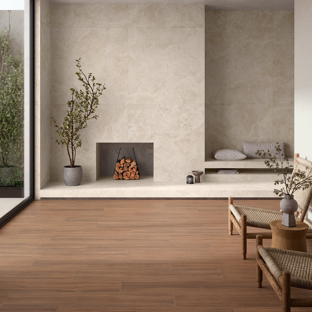 A modern interior room with warm medium-brown wood plank flooring, textured beige walls, a built-in fireplace with stacked lo
